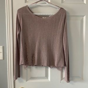 Distressed light sweater